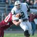The Fighting Irish's Austin Hundley runs the ball against the Raiders during the second quarter of Saturday afternoons game. Courtney Sacco I AnnArbor.com 